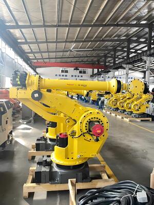 เซลล์ตัดเลเซอร์ FANUC พร้อมการบรรจุ / ถอนอัตโนมัติและโต๊ะหมุนสําหรับการผลิตขนาดใหญ่ของชิ้นงานโลหะ 3 มิติในอุตสาหกรรมรถยนต์