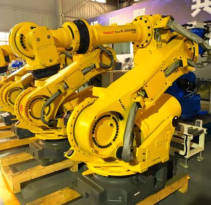 เซลล์ตัดเลเซอร์ FANUC พร้อมการบรรจุ / ถอนอัตโนมัติและโต๊ะหมุนสําหรับการผลิตขนาดใหญ่ของชิ้นงานโลหะ 3 มิติในอุตสาหกรรมรถยนต์